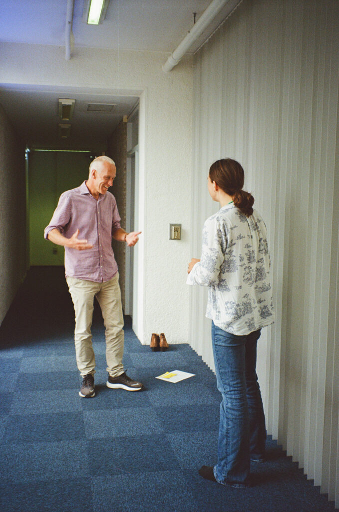 Ekaterina laughing with a participant after playing catch together